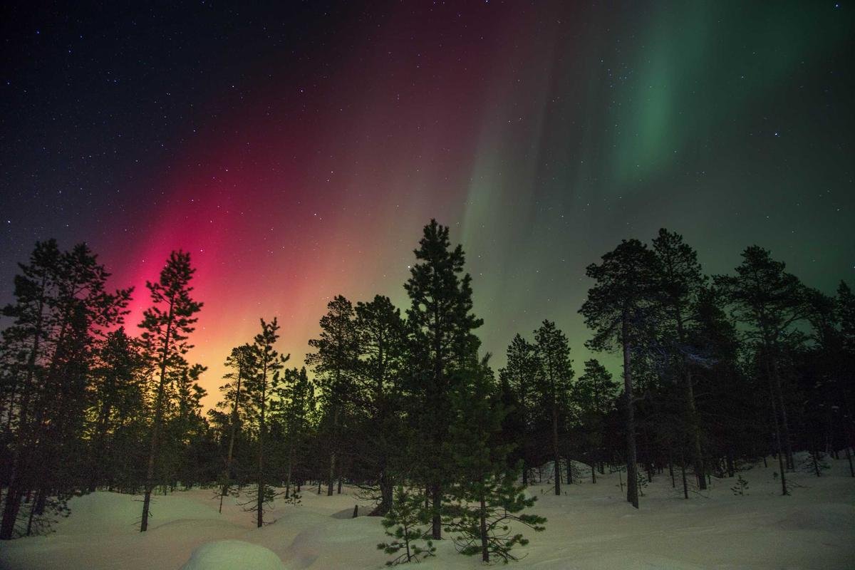 Northern Lights aurora borealis over Iceland winter landscape