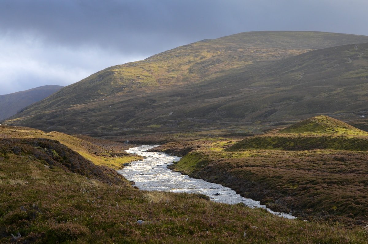 Scottish Highlands stream flowing through wild mountain landscape