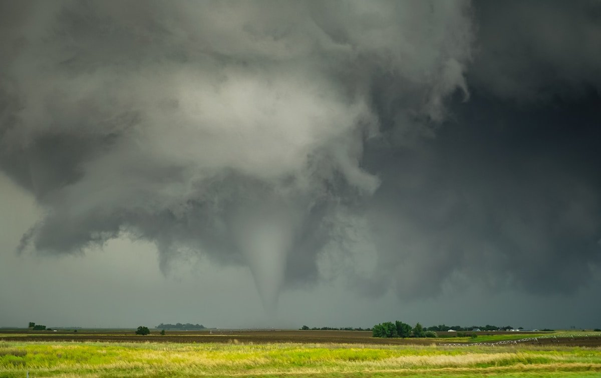 Large storm cloud looming over a field, severe weather