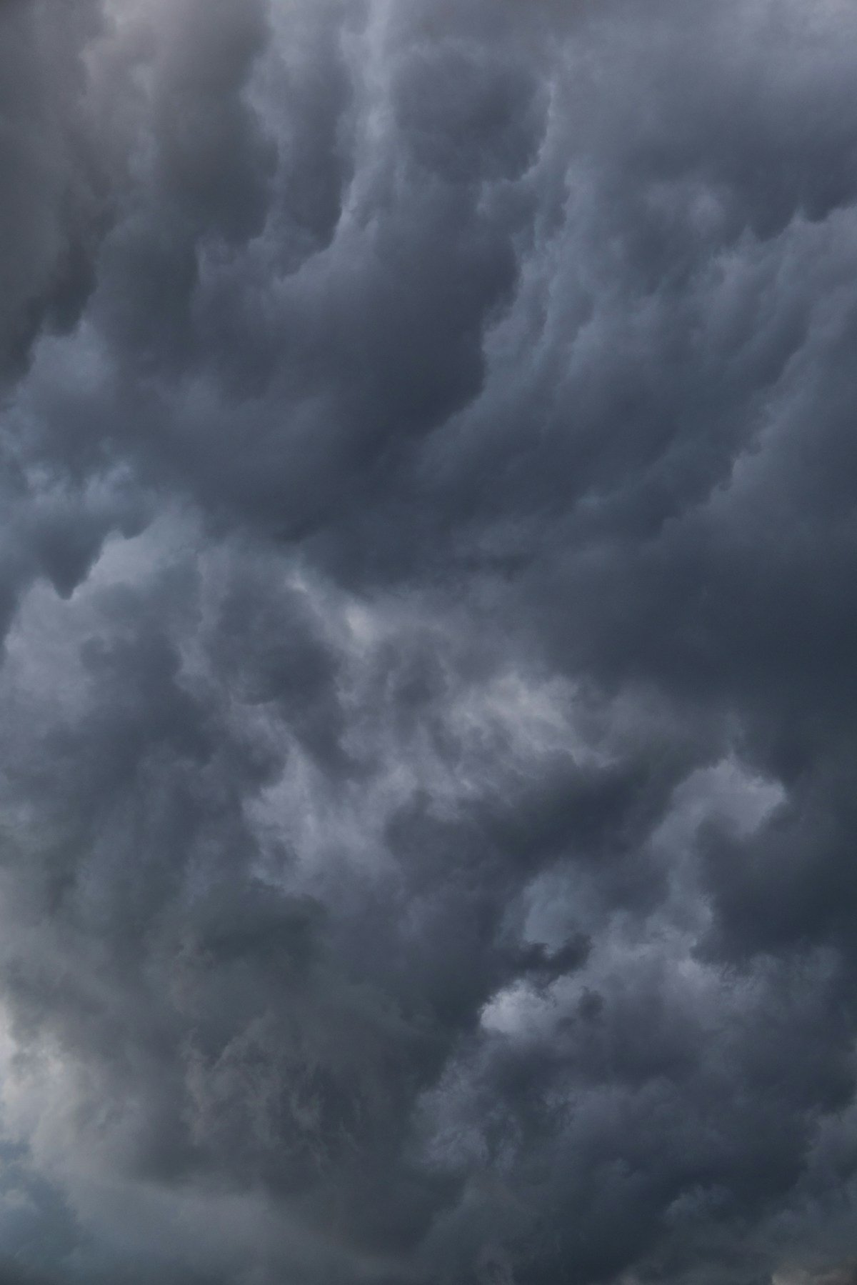 Dark dramatic storm clouds gathering overhead before a severe thunderstorm