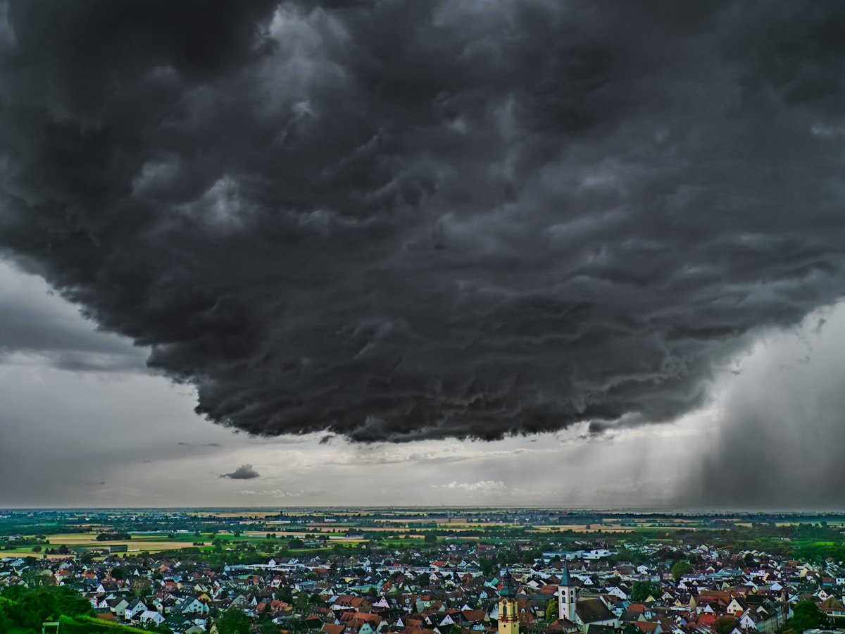 Dark storm clouds gathering over a town
