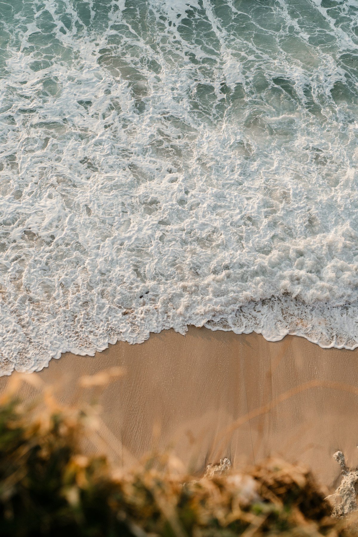 Ocean waves crashing on a sandy beach