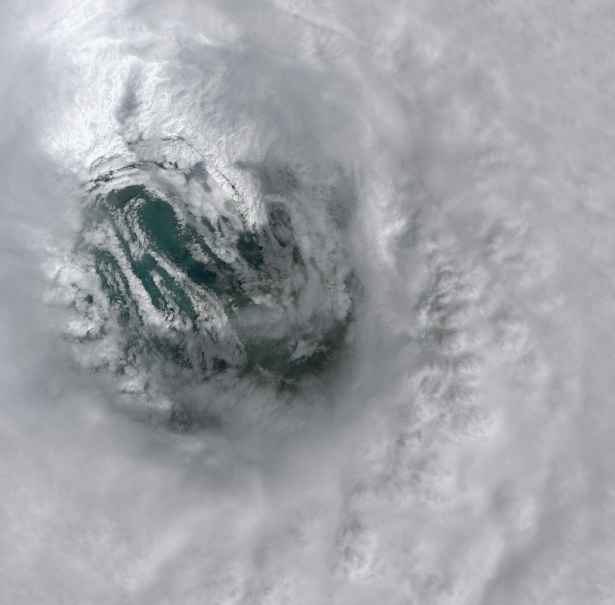 Satellite view of a swirling hurricane eye over the ocean