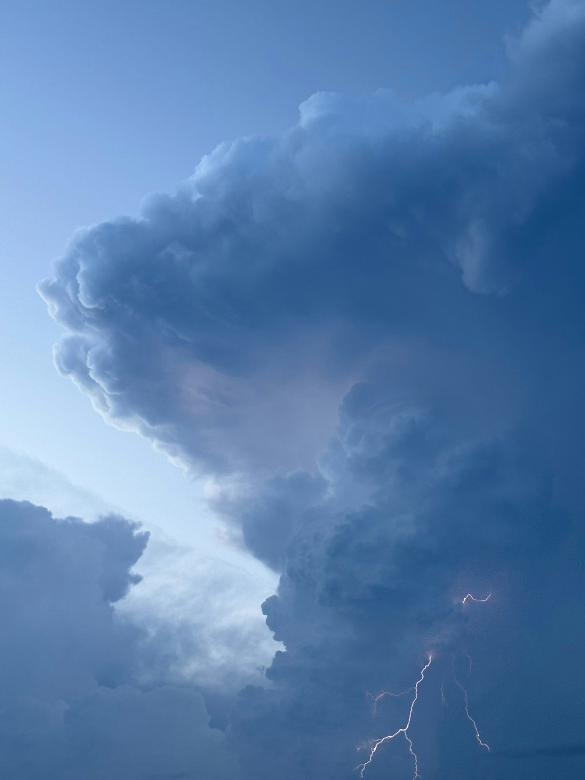 Lightning striking from dark storm clouds