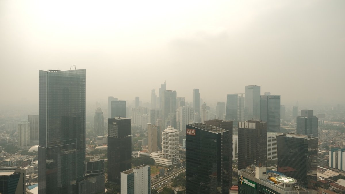 City skyline shrouded in thick smog and haze from wildfire smoke